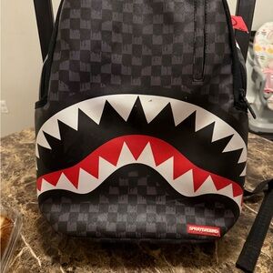 Sprayground Black and Red Shark Mouth Backpack